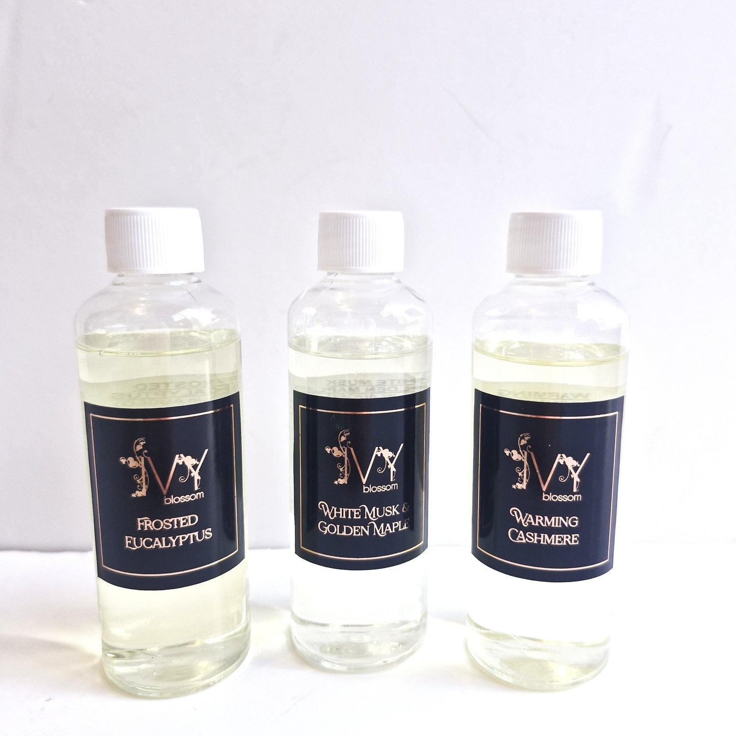 Reed Diffuser Refills in Frosted Eucalyptus, White Musk & Golden Maple, and Warming Cashmere scents.