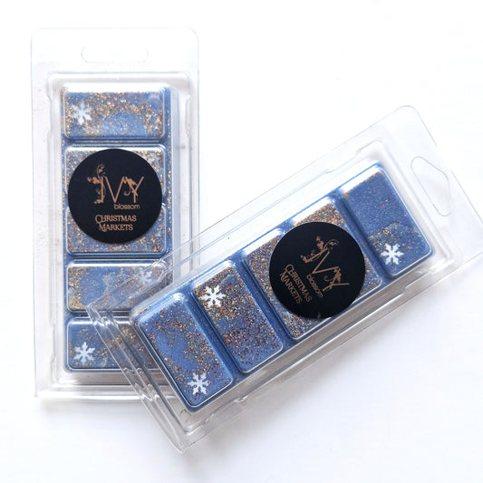 Christmas Market Wax Melt in blue packaging with glitter and snowflake designs, perfect for festive scents.