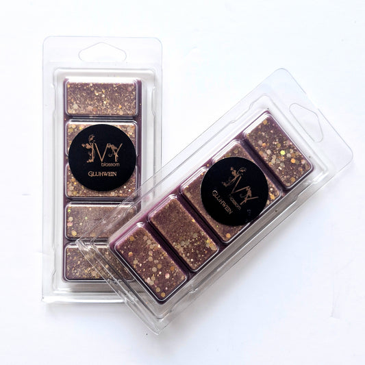 Gluhwein Wax Melt in packaging, featuring rich colors and festive sparkles, perfect for winter ambiance.