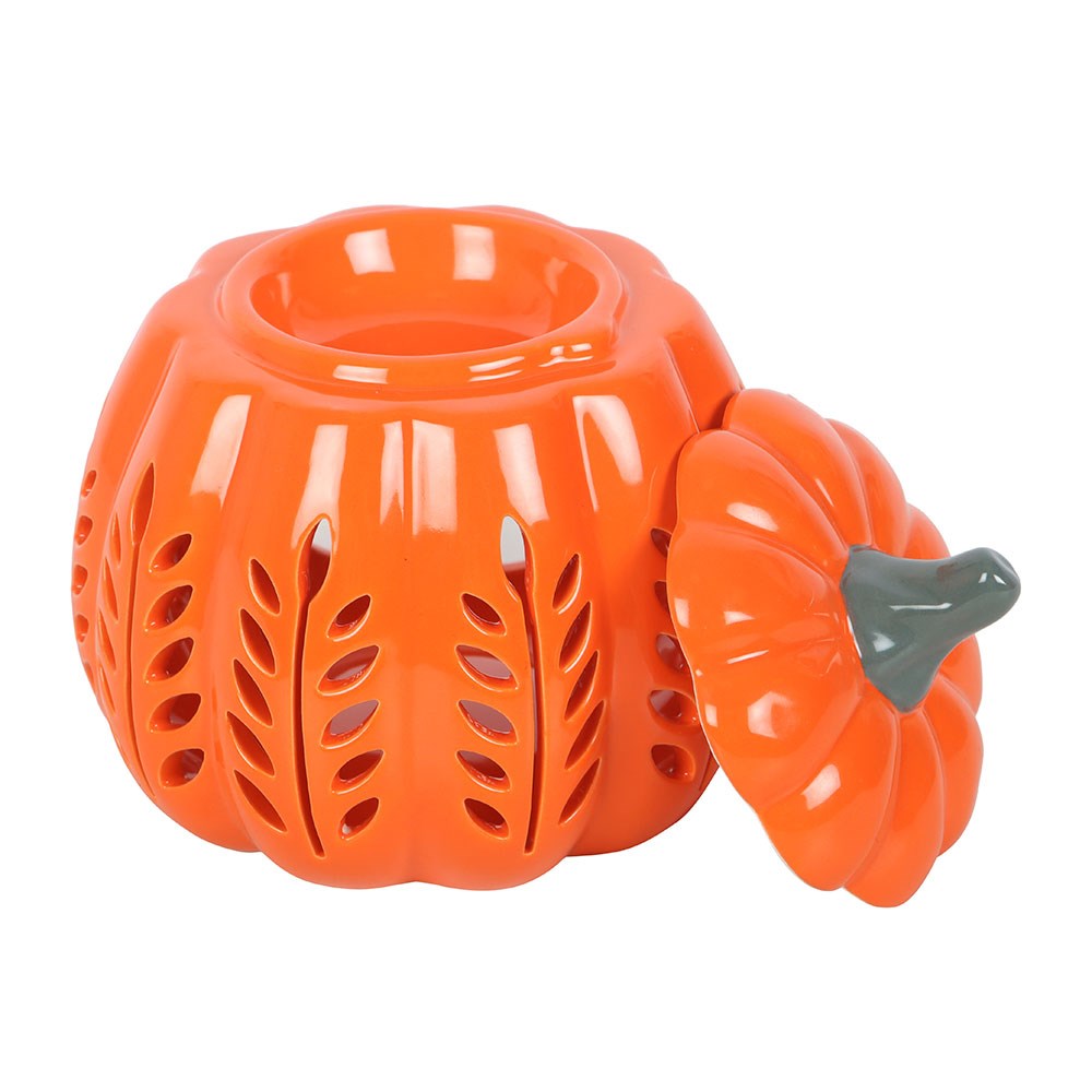 Orange ceramic pumpkin lantern with a lid on a white background