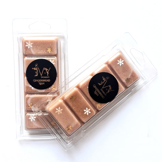 Gingerbread Man wax melt in clear packaging with decorative snowflakes and gingerbread designs.