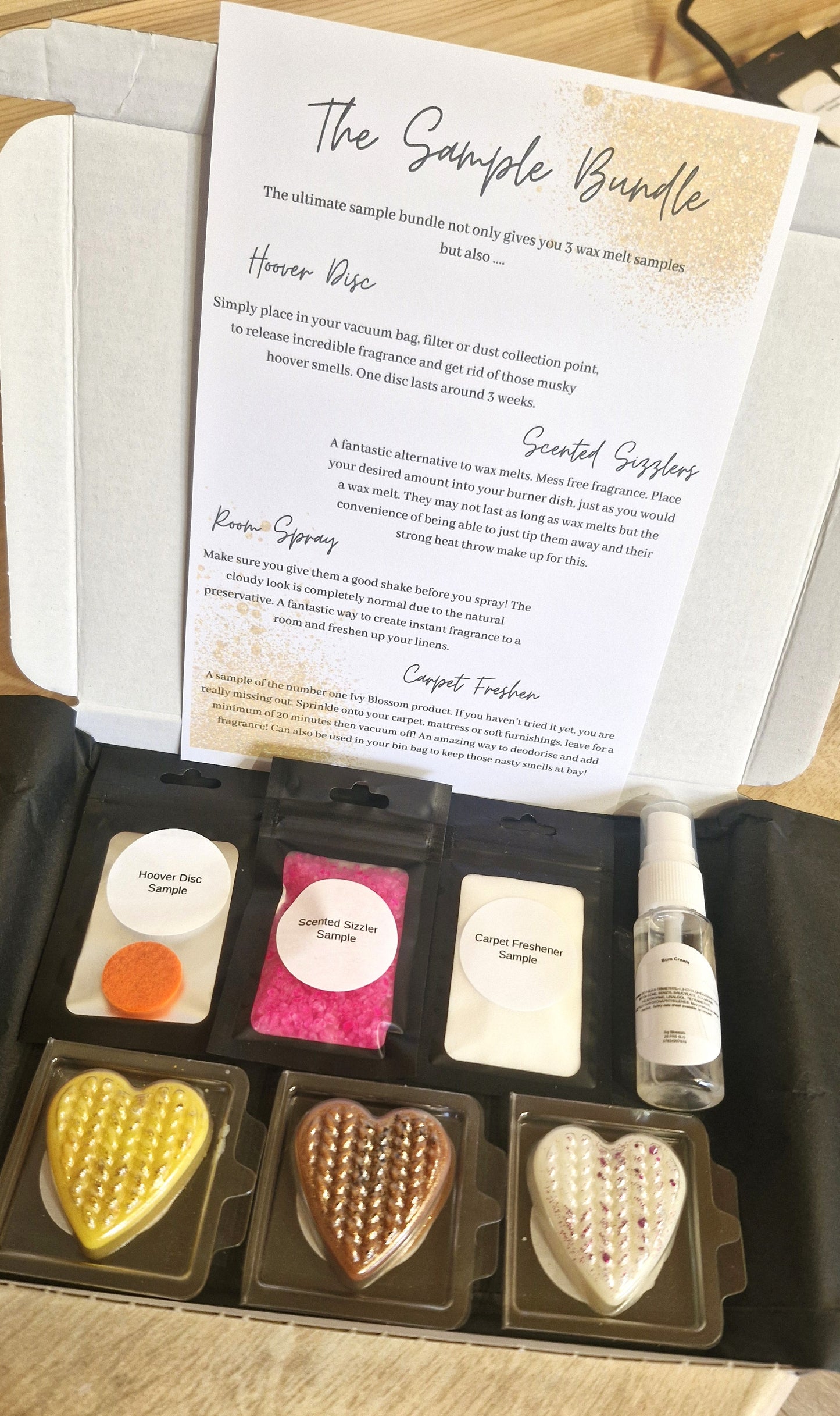 Home Fragrance Sample Bundle Boxes containing wax melts and freshening sprayers showcased in an elegant box.