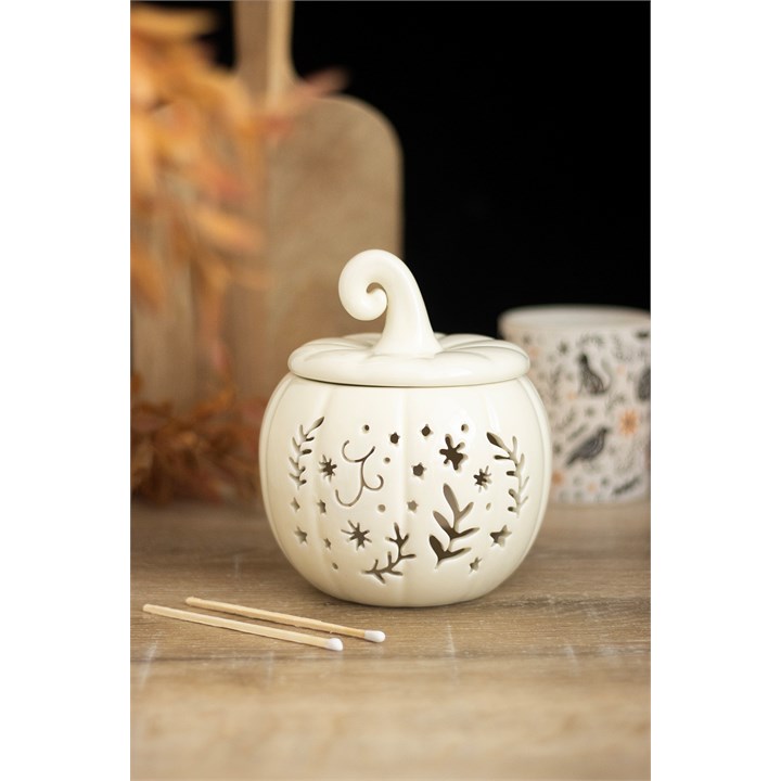 White Pumpkin Leaf Cut Out Tealight Wax Burner on a wooden surface with decorative elements.